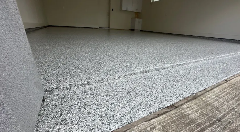 Garage floor with durable speckled coating